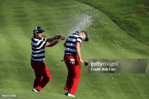 Charlie Hoffman sprays Daniel Berger of the U.S. Team with champagne after Berger defeated Si Woo Kim of South Korea and the International Team on...
