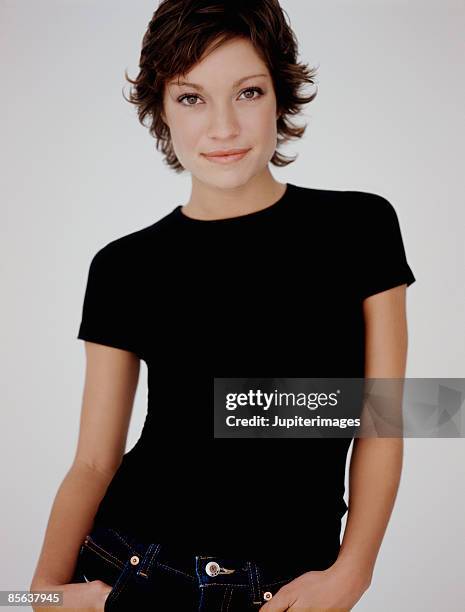 portrait of woman wearing black t-shirt - black t shirt stock pictures, royalty-free photos & images