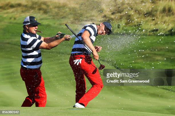 Charlie Hoffman sprays Daniel Berger of the U.S. Team with champagne after Berger defeated Si Woo Kim of South Korea and the International Team on...