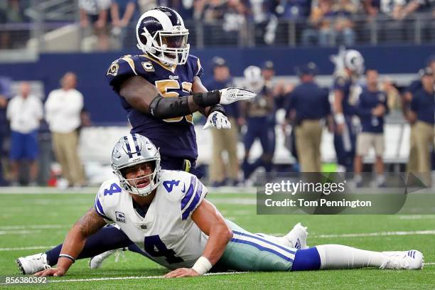 Dak Prescott of the Dallas Cowboys reacts as Alec Ogletree of the Los Angeles Rams celebrates after the the Dallas Cowboys failed to score on a two...