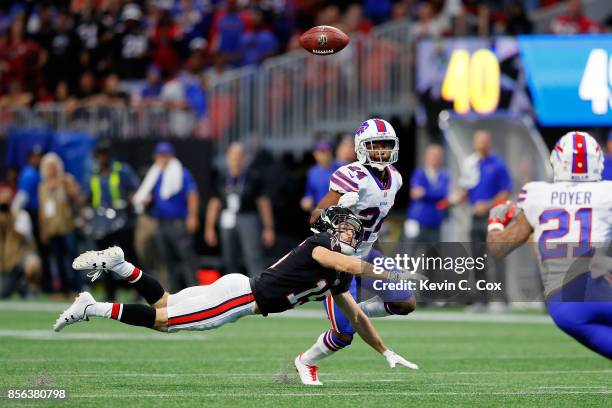 Nick Williams of the Atlanta Falcons fails to pull in a pass against Leonard Johnson of the Buffalo Bills during the second half at Mercedes-Benz...