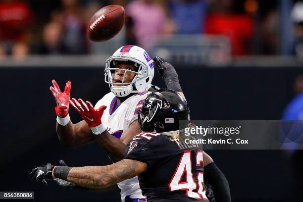 Charles Clay of the Buffalo Bills catches a pass against Duke Riley of the Atlanta Falcons during the second half at Mercedes-Benz Stadium on October...