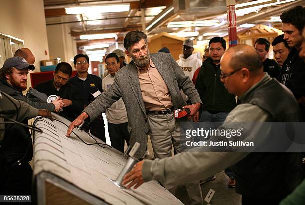 Max Parsley points to a section of roof during a solar panel installation course at City College of San Francisco March 26, 2009 in San Francisco,...