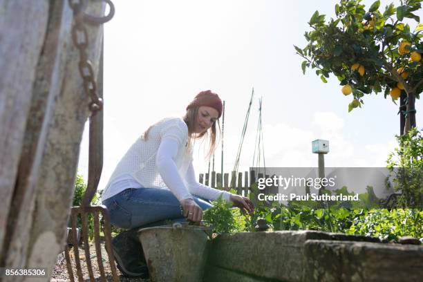 teenage girl doing gardening - matamata stock pictures, royalty-free photos & images