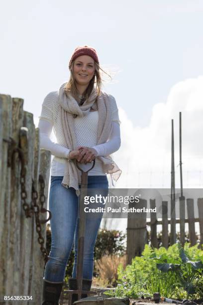 teenage girl standing outdoors in a vegetable garden. - matamata stock pictures, royalty-free photos & images