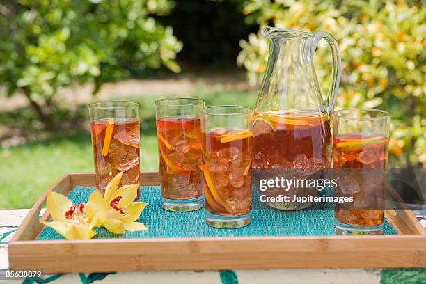 pitcher and glasses of fruit iced tea - jug stock pictures, royalty-free photos & images