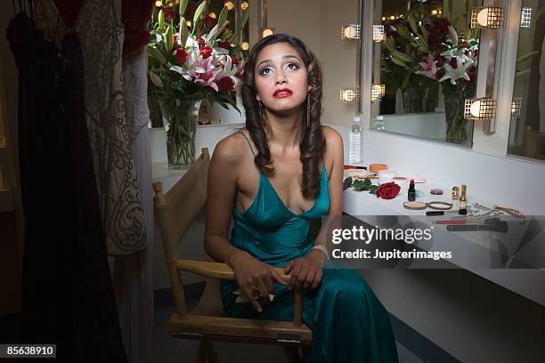 portrait of actress sitting in dressing room - directors chair stock pictures, royalty-free photos & images