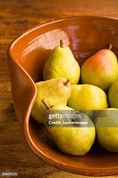 bowl of william pears - bartlett pear stock pictures, royalty-free photos & images