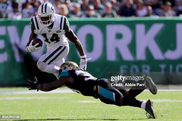 Jeremy Kerley of the New York Jets jumps over Tashaun Gipson of the Jacksonville Jaguars in the second half during their game at MetLife Stadium on...