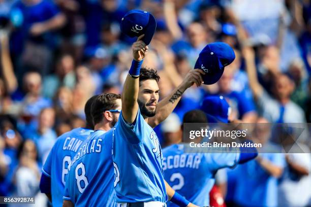 Eric Hosmer, Mike Moustakas, Lorenzo Cain, and Alcides Escobar of the Kansas City Royals waves to the crowd after being taken out of the game during...