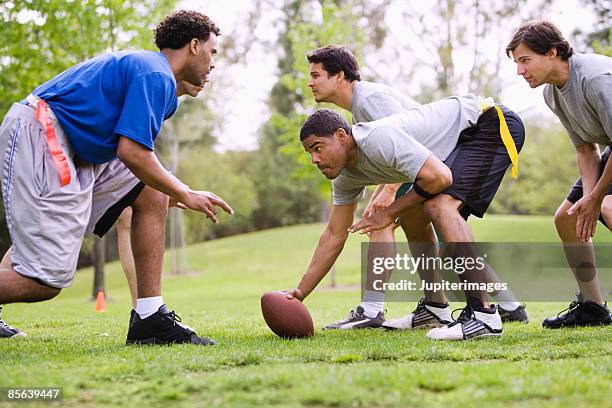 men playing flag football - kinder football stock-fotos und bilder