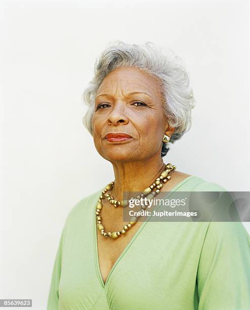 serious woman - black woman grey hair stock pictures, royalty-free photos & images