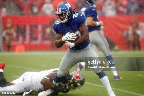 Running back Paul Perkins of the New York Giants is stopped by defensive tackle Gerald McCoy of the Tampa Bay Buccaneers during a carry in the first...