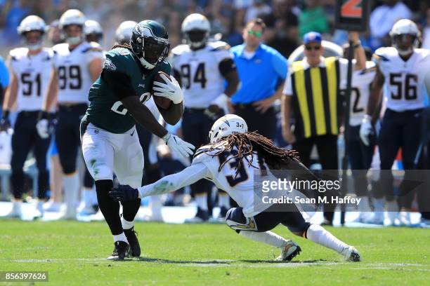 LeGarrette Blount of the Philadelphia Eagles rushes against Jahleel Addae of the Los Angeles Chargers during the NFL game the at StubHub Center on...