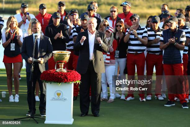President Donald Trump presents the U.S. Team with the trophy after they defeated the International Team 19 to 11 in the Presidents Cup at Liberty...