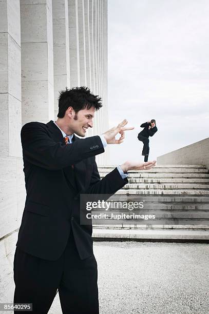 side view of playful men - dare un colpetto foto e immagini stock