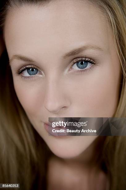 smiling woman - female 18 21 blonde blue eyes stock-fotos und bilder