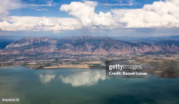 clouds over the wasatch mountains of northern utah from the air - mt timpanogos stock pictures, royalty-free photos & images