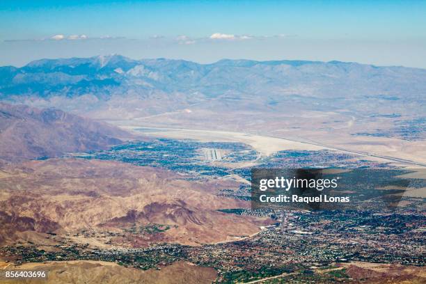 aerial view of palm springs area with airport in center frame - palm desert stock pictures, royalty-free photos & images