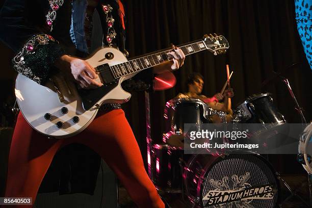 band performing - glam rock stock pictures, royalty-free photos & images