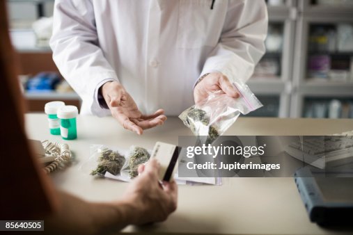 Pharmacist and customer with medical marijuana Pharmacist and customer with medical marijuana