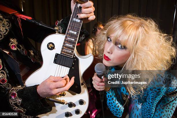 band performing - glam rock stock pictures, royalty-free photos & images