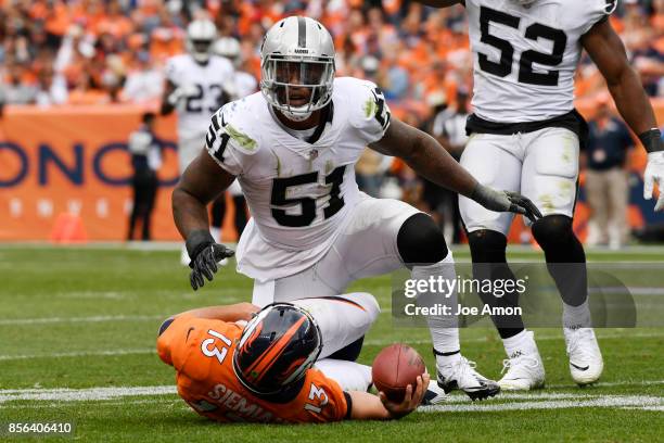 Bruce Irvin of the Oakland Raiders celebrates after sacking Trevor Siemian of the Denver Broncos during the second quarter on Sunday, October 1,...