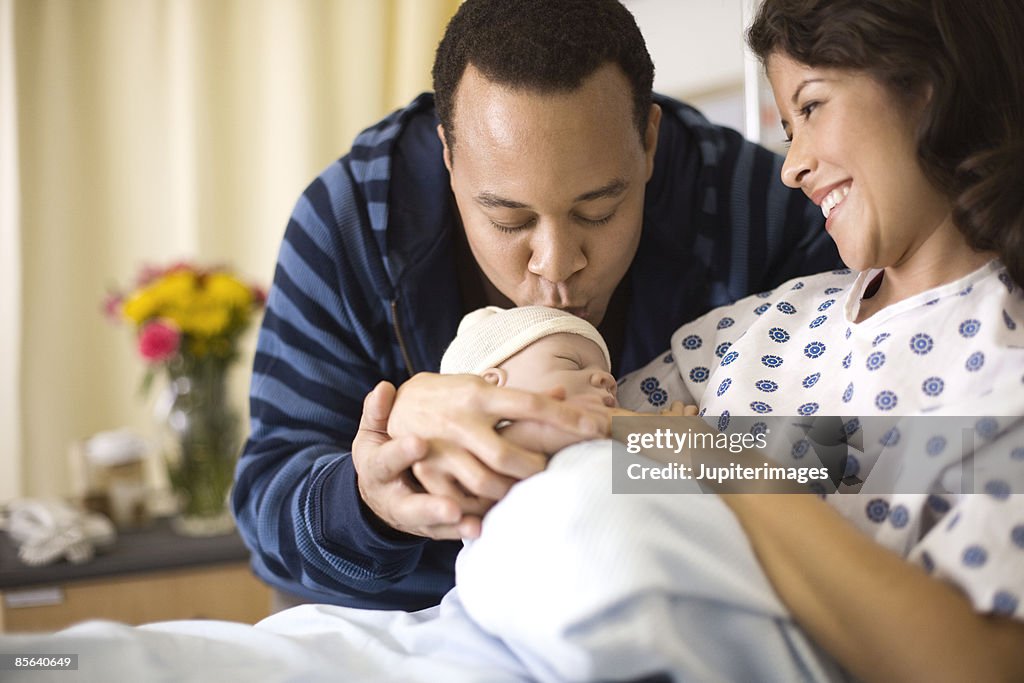 Mother and father with newborn infant