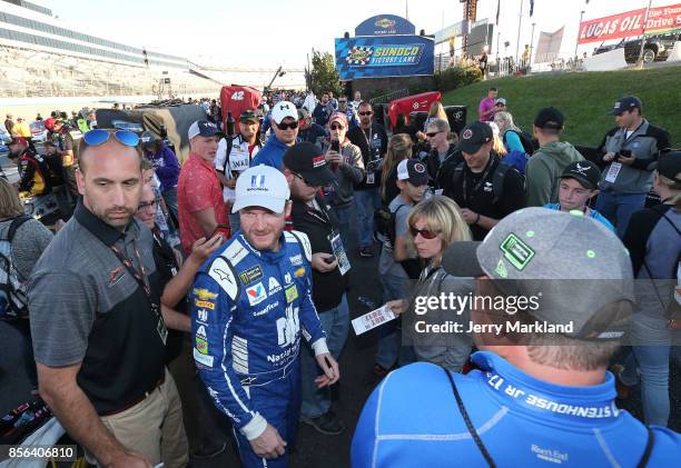 Dale Earnhardt Jr., driver of the Nationwide Chevrolet, walks down pit road following the Monster Energy NASCAR Cup Series Apache Warrior 400...