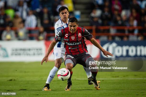 Emmanuel Garcia of Pachuca struggles for the ball with Luis Perez of Necaxa during the 12th round match between Pachuca and Necaxa as part of the...