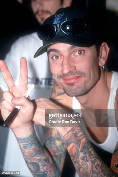 Musician Tommy Lee of the group Motley Crue shows a peace sign while posing for a portrait circa 1995 in Los Angeles, California.