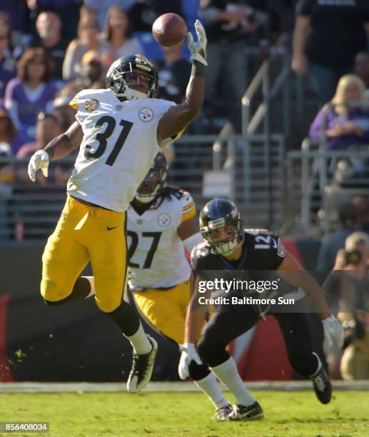 Pittsburgh Steelers safety J.J. Wilcox watches cornerback Mike Hilton knock down a high pass from Baltimore Ravens quarterback Joe Flacco for an...