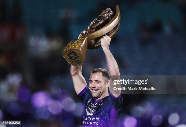 Cameron Smith of the Storm celebrates and holds aloft the NRL Premiership trophy after winning the 2017 NRL Grand Final match between the Melbourne...