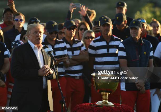 President Donald Trump speaks during the trophy presentation of the Presidents Cup golf championship at Liberty National Golf Club in Jersey City,...
