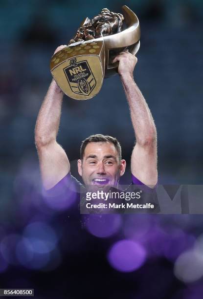 Cameron Smith of the Storm celebrates and holds aloft the NRL Premiership trophy after winning the 2017 NRL Grand Final match between the Melbourne...
