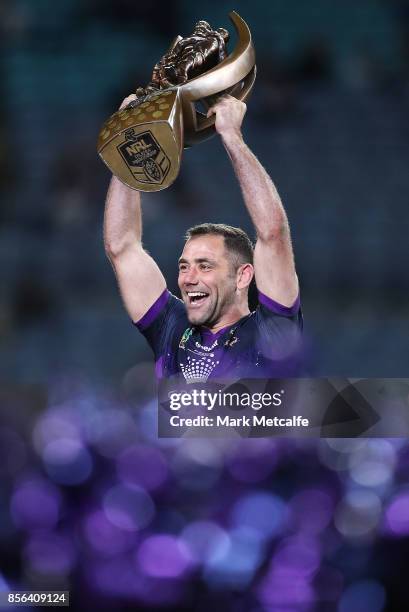 Cameron Smith of the Storm celebrates and holds aloft the NRL Premiership trophy after winning the 2017 NRL Grand Final match between the Melbourne...