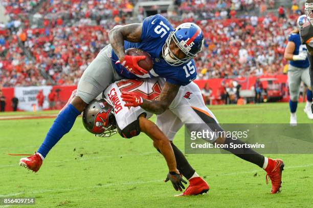 New York Giants wide receiver Brandon Marshall is brought down by Tampa Bay Buccaneers cornerback Brent Grimes after a reception during an NFL...