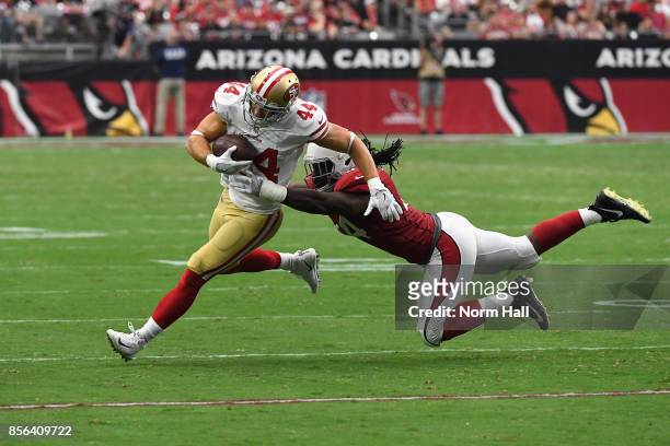 Outside linebacker Markus Golden of the Arizona Cardinals hits fullback Kyle Juszczyk of the San Francisco 49ers during the second half of the NFL...