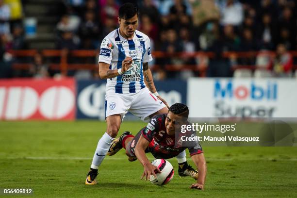 Emmanuel Garcia of Pachuca struggles for the ball with Luis Perez of Necaxa during the 12th round match between Pachuca and Necaxa as part of the...