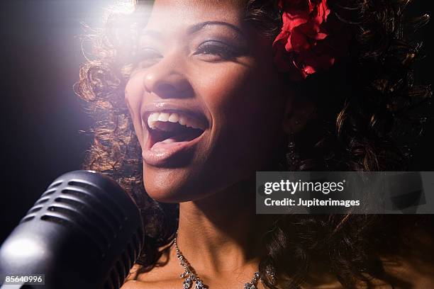 singer performing in nightclub - flower show imagens e fotografias de stock