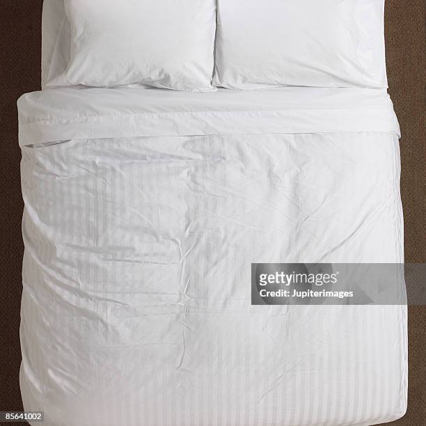 bed - duvet stock pictures, royalty-free photos & images