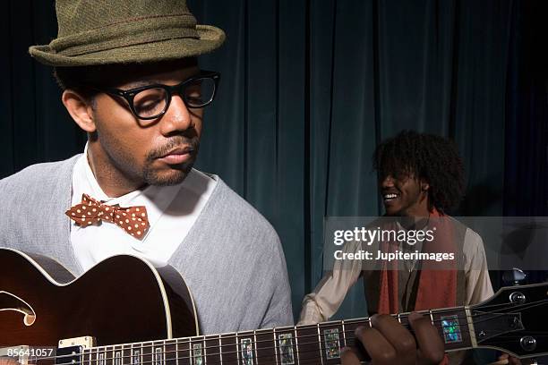 guitarist playing in nightclub - jazz smilling stock pictures, royalty-free photos & images