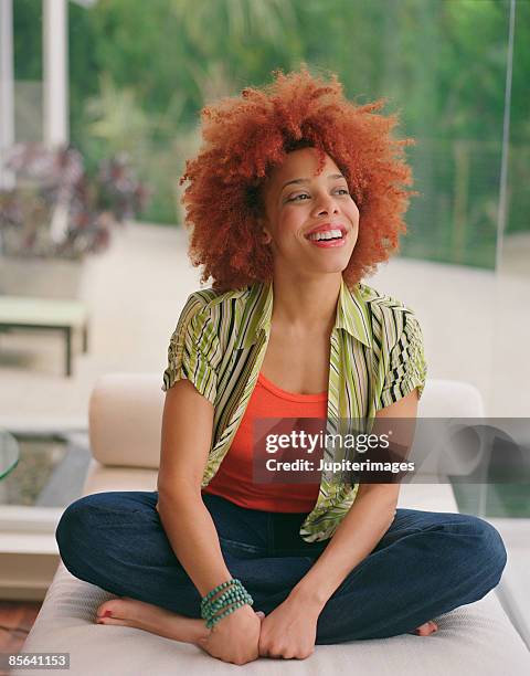 portrait of laughing woman - barefoot redhead ストックフォトと画像