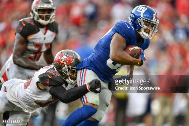New York Giants wide receiver Sterling Shepard is brought down by Tampa Bay Buccaneers cornerback Robert McClain after a catch during an NFL football...