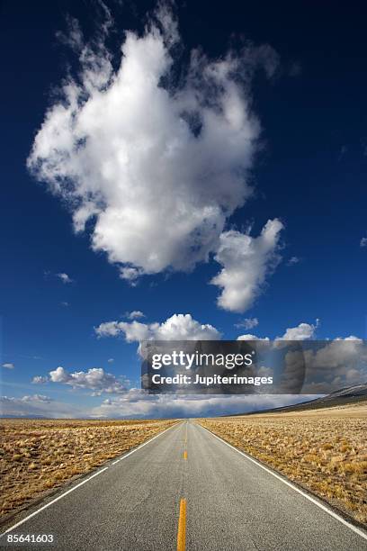 rural highway through mountains, colorado - alamosa county stock pictures, royalty-free photos & images