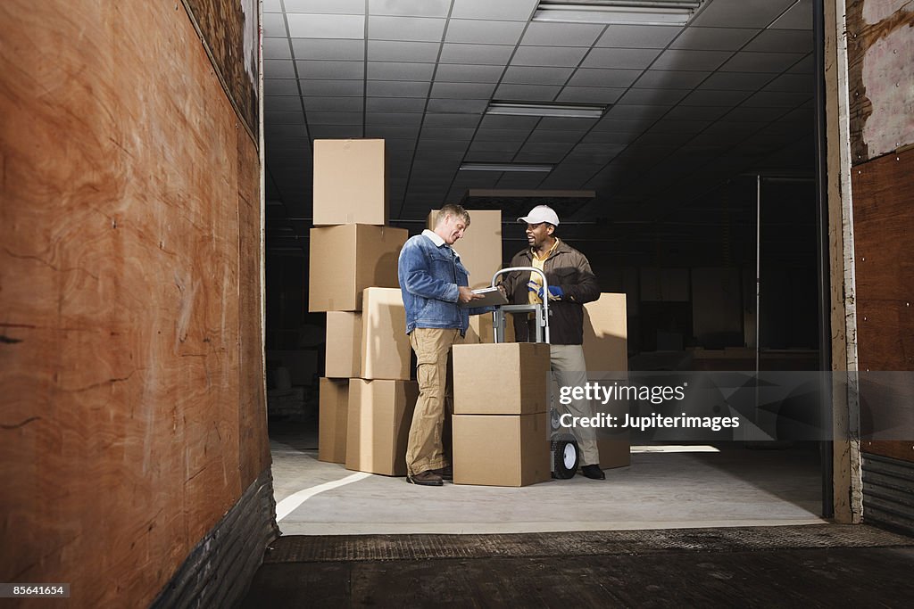 Man signing for delivery