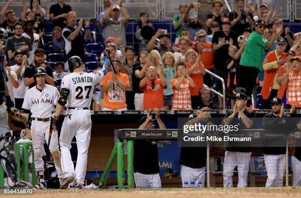 Giancarlo Stanton of the Miami Marlins takes a curtain call during a game against the Atlanta Braves at Marlins Park on October 1, 2017 in Miami,...