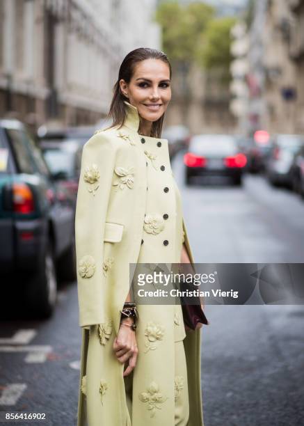 Adriana Abascal wearing yellow coat seen outside Valentino during Paris Fashion Week Spring/Summer 2018 on October 1, 2017 in Paris, France.