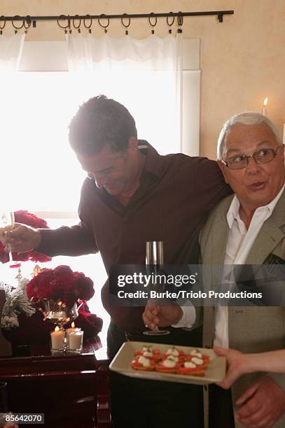 men at christmas party - christmas party canapes stock pictures, royalty-free photos & images
