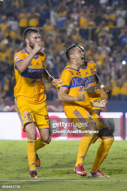 Juninho of Tigres celebrates with teammate Andre Gignac after scoring his team's winning goal via penalty during the 12th round match between Tigres...